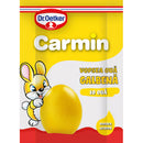 Yellow egg dye paste in a small jar with a white lid, labeled Carmin from Dr. Oetker, used for decorating Easter eggs.