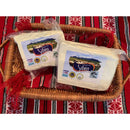 Fresh Sibiu Telemea cheese from sheep's milk by Asociatia Producatorilor de Telemea de Sibiu, showing the creamy cheese block.