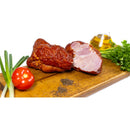 Smoked boneless homemade ham from DELUMANI, sliced and ready to serve, showcasing its rich, smoky flavor and tender texture.
