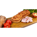 Sliced smoked homemade Kaizer ham from DELUMANI, showcasing its rich, smoky flavor and marbled texture in a close-up image.