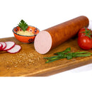 Sliced homemade chicken breast parizer from DELUMANI, showing tender, pink chicken meat slices on a clean white background.