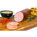 Delumani summer homemade salami slices, thinly sliced mezeluri with a rustic appearance, on a white background.